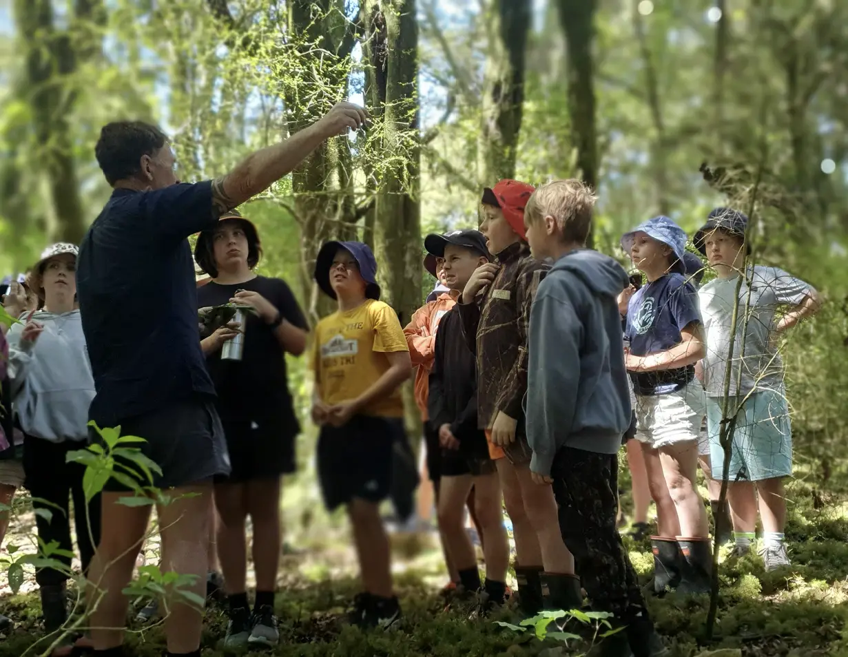 Trevor Thompson teaching school children about native forests