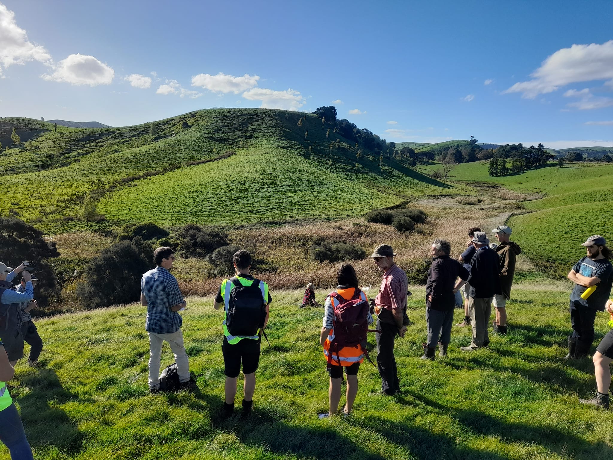 A group of people looking at a wetland at Hapua, Tauweru