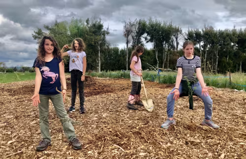 Students from Te Kura O Papatuanuku Wairarapa Earth School in Carterton planting native trees
